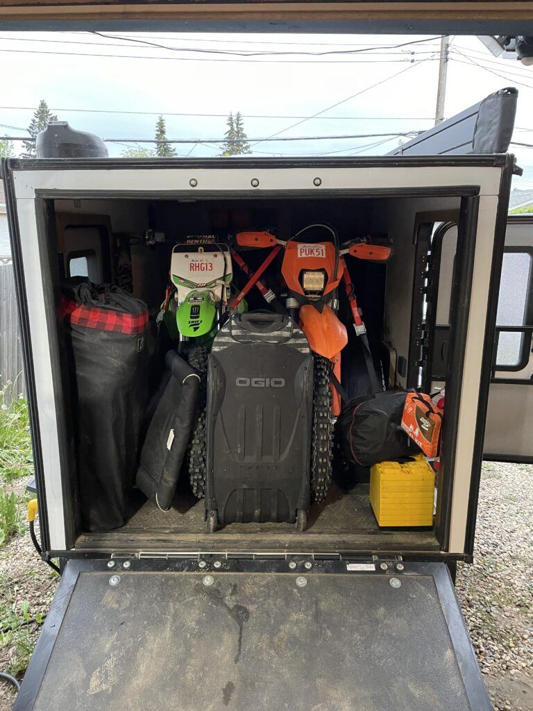 camper loaded with dirtbikes